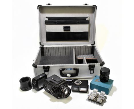 HASSELBLAD; a 500C/M camera body with Carl Zeiss f= 80mm lens, no.6307020, with assorted accessories including back plate no.