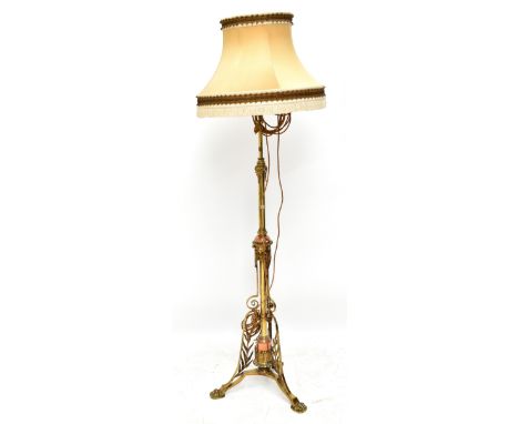 A Victorian lacquered brass and copper standard lamp, on triform base with brass paw feet, height 173cm inclusive of the bras