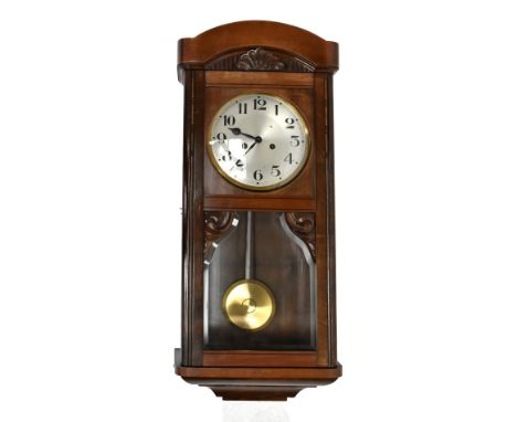 A 1930s oak and stained beech regulator type wall clock, with silvered Arabic numeral dial, length 24cm.Additional Informatio