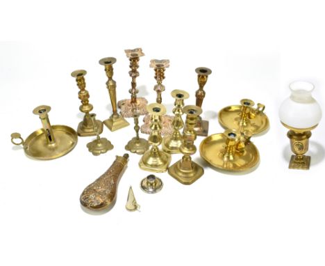 A quantity of assorted metalware including a pair of silver plated candlesticks, assorted brass candlesticks, a brass powder 