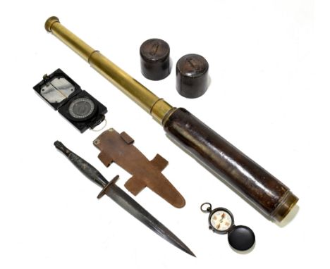 A mixed group of militaria comprising a Fairbairn-Sykes type commando dagger with blackened blade, in leather scabbard, lengt