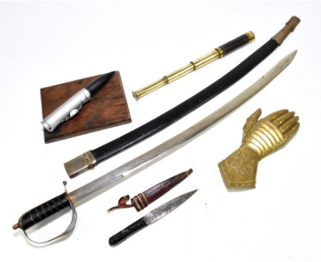 A 20th century Indian sword with canvas scabbard, length 97cm, together with a painted model of a bullet raised on wooden pli