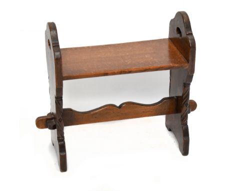 An early 20th century ecclesiastical oak stool, with carved detailing, height 60cm, width 68cm, depth 28cm.Additional Informa