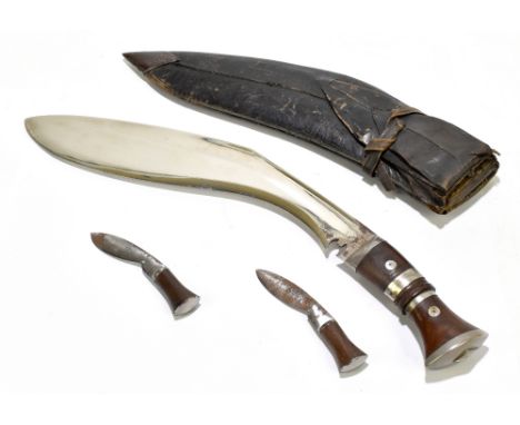 A Gurkha kukri knife, with 32cm blade in leather scabbard with two smaller knives, overall length 44.5cm.Additional Informati