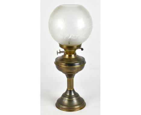 A 20th century brass oil lamp with frosted glass shade, raised on a single Corinthian column, height 55cm, complete with chim