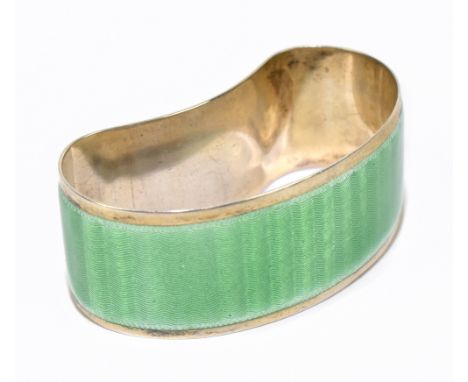 TURNER &amp; SIMPSON; a George V hallmarked silver and light green guilloche enamel Art Deco napkin ring of shaped form, Birm