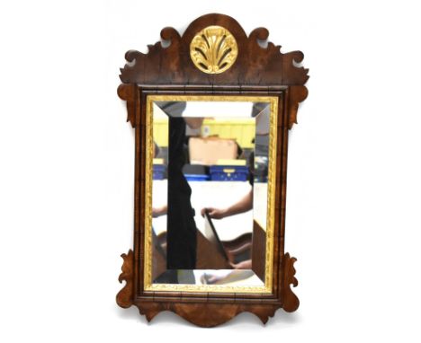 A Chippendale-style fretwork wall mirror with gilt detail and bevelled glass, 70 x 42cm.Additional InformationSome splits, sc