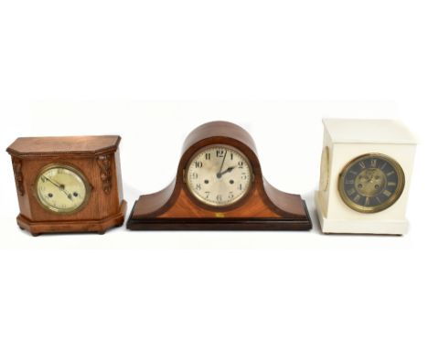 A French eight day mantel clock with Roman numeral dial and visible escapement with the movement stamped 'Moulin', striking o