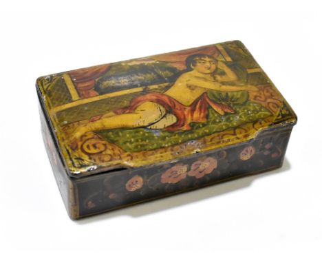 An unusual 19th century papier-mâché snuff box, possibly Indian, featuring painted semi-clothed youth to hinged lid with furt