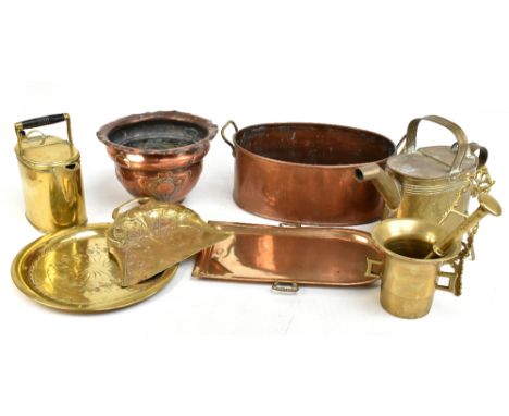 A small group of metalware comprising Art Nouveau copper planter and brass tray, both with relief foliate decoration, pestle 