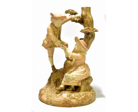 HADLEY ROYAL WORCESTER; a large hand painted blush ivory figure group, representing a boy passing a bird's nest down to a sea