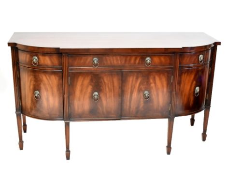 A reproduction mahogany sideboard, with three drawers above four cupboard doors on moulded and tapered legs, height 92cm, wid