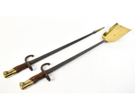 Two brass mounted bayonets fashioned into a pair of fire tools, poker and shovel, length of shovel 66.5cm.