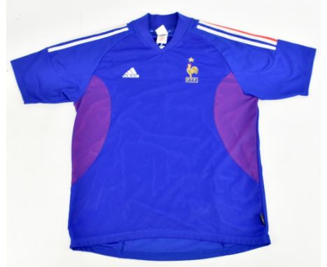 ZINEDINE ZIDANE; an Adidas France home shirt signed and no. 10 to reverse, no size stated.Additional InformationCreasing and 