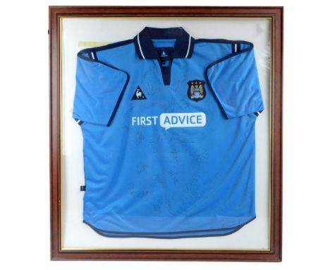 MANCHESTER CITY; a framed autographed Le Coq Sportif&nbsp;2002-2003 home shirt, bearing various signatures, with certificate 