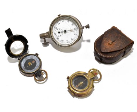 A WWI military issue brass compass stamped 'F-L number 81142' and dated 1917, with another similar lacquered brass compass st