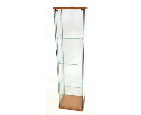 A modern glass display cabinet with three shelves, on plinth base, height 104cm, width 43cm, depth 37cm.Additional Informatio