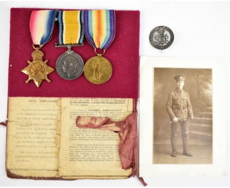 A WWI medal trio awarded to 1632 Pte. R. Bowers Manchester Regiment with Empire badge, photograph and two contemporary docume