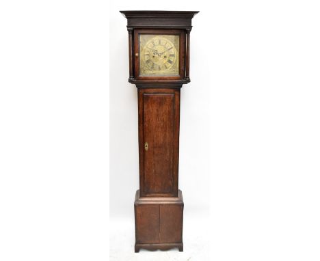 RANDLE MADDOCK; a George III eight day oak longcase clock, with Roman numeral brass chapter ring and centre engraved ‘Randle 