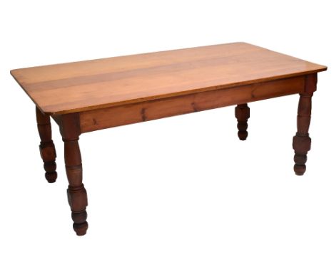 A Victorian style stained pitch pine farmhouse kitchen style table, the rectangular top with moulded corners, on turned and b