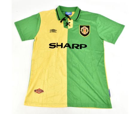 ERIC CANTONA; an Umbro Manchester United 1992-94 seasons retro reproduction away shirt signed with ‘Cantona 7’ to reverse, si