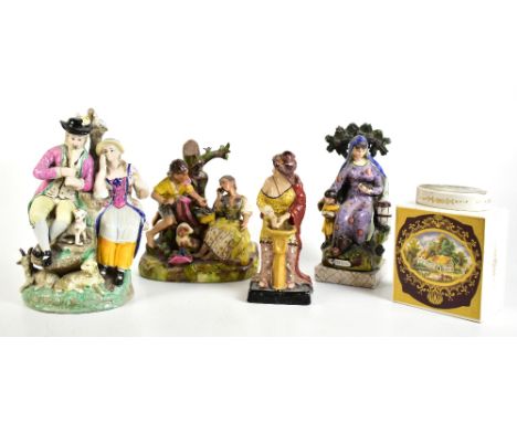 Four Staffordshire figures and groups, comprising two courting couples, the first with dog and lamb at their feet, height 27c