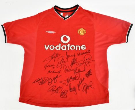 MANCHESTER UNITED; an Umbro 2001 home shirt signed by Woolwork, Veron, Barthez, Yorke, Keane, Van der Gouw, Forlan, G. Nevill