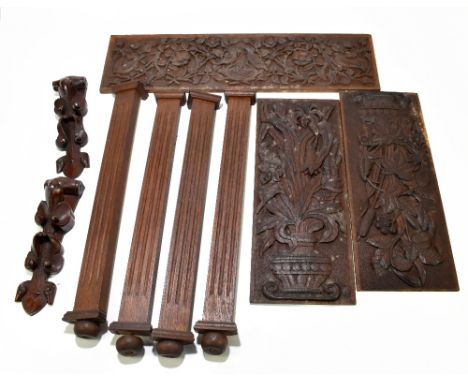A collection of assorted furniture panels and sections, including three carved oak panels decorated with birds of paradise an