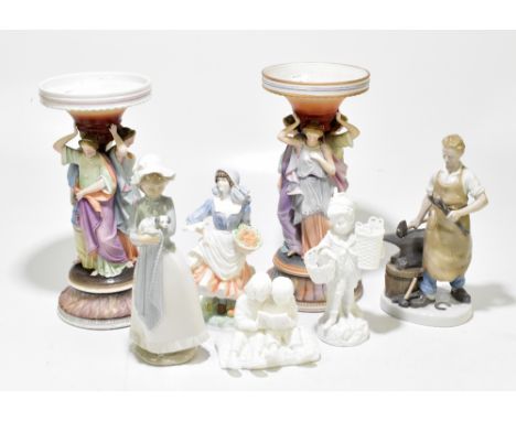 A group of ceramic figures including a near pair of Continental bisque porcelain vases, with figural columns modelled as the 