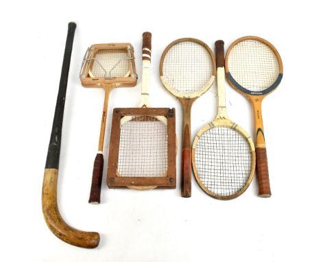 Four vintage tennis rackets including a Merlin, a Dunlop badminton racket and a hockey stick (6).