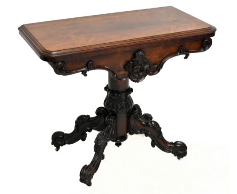 An early Victorian rosewood card table, the rectangular top with a moulded edge above a serpentine frieze, on scroll legs, he