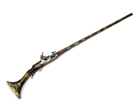 A late 18th/early 19th century Ottoman style flintlock small bore musket with eight applied bands bearing simple decoration, 