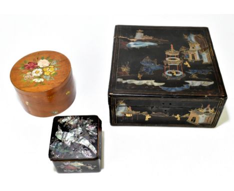 A late 19th century Cantonese lacquered box decorated with scenes of figures and pavilions in gardens, height 12cm, width 27c