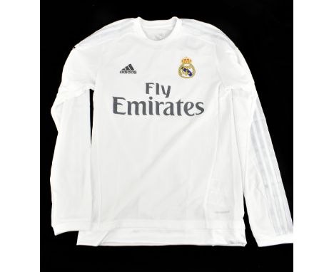 CRISTIANO RONALDO; an Adidas C. F. Real Madrid long-sleeved home shirt signed with ‘Ronaldo 7’ to reverse, size XS. Additiona