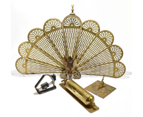 A folding fan shaped fire screen, with cast detailing throughout, height 60.1cm, together with a brass fire extinguisher, a s