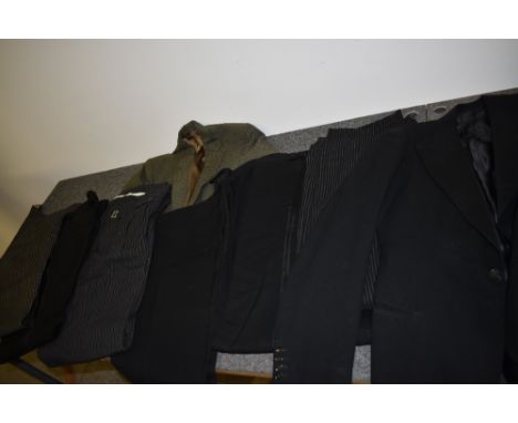 A mixed lot of early gents dress trousers, predominantly with button fly, also included are two suit jackets.