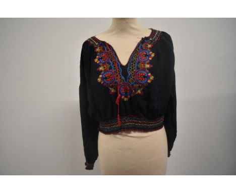 A vintage navy blue Hungarian embroidered peasant blouse.