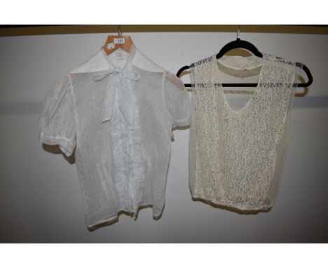 A 1940s organdie blouse having button front with ruffle and pussy bow and a 1930s lace and tulle blouse.