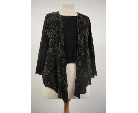 An Art Deco top or bodice having extensive bead work,silk lining, fluted sleeves and integrated modesty panel fastening to on