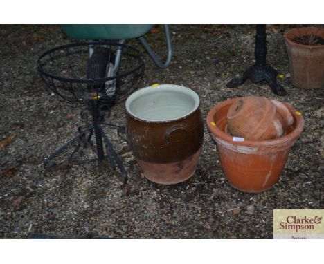 A quantity of terracotta plant pots, a glazed planter and a metal planter