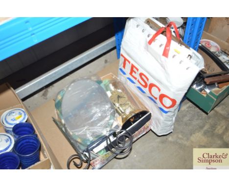 A box containing various clocks; radio alarm clock; a bag of hooks etc
