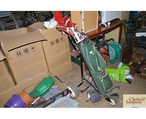 A leather golf bag and contents on Power Caddy trolley