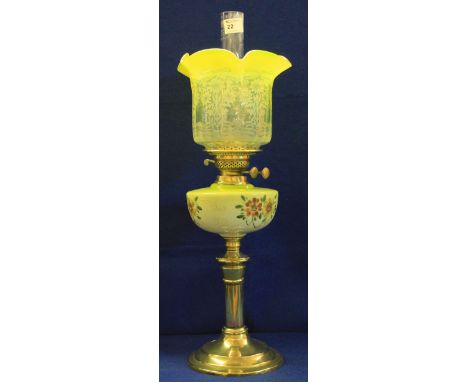 Brass double burner oil lamp with painted opaline glass reservoir on a brass pedestal and circular base. Vaseline glass folia