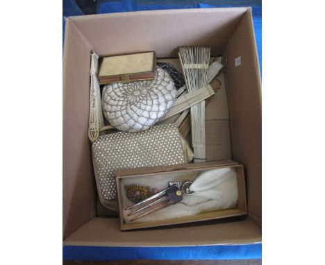 Box containing assorted lady's pierced fans, vintage sequined handbags, evening bags, hair comb ties etc. 