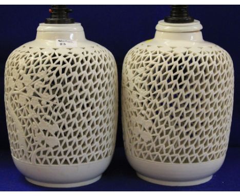 Pair of reticulated oriental style pottery lamp bases of baluster form. (2)