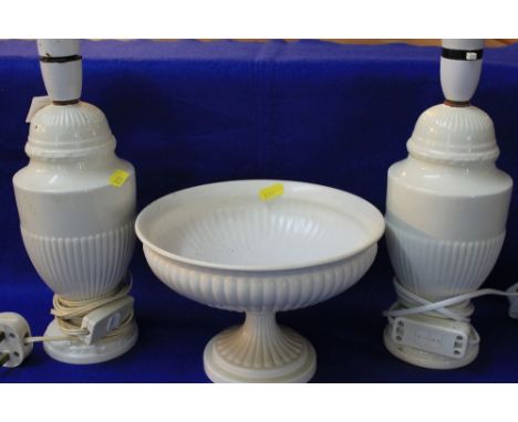 Pair of Wedgwood china ivory ground urn shaped lamp bases together with a similar pedestal bowl. (2)