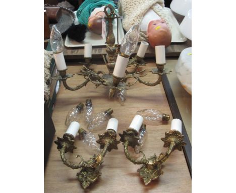 Brass foliate decorated five section candelabra ceiling light together with two matching wall sconces. 
