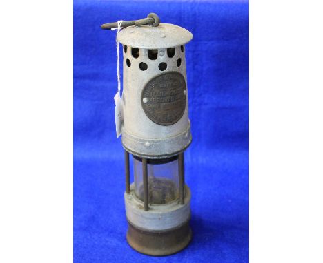 Pale Wood and Ackroyd Limited 'Pale Wood's Approved Lamp', an aluminium and brass miner's safety lamp.