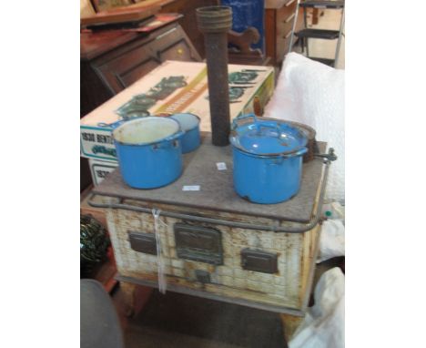Vintage tin plate child's cooking stove with blue enamel cooking pans. 
