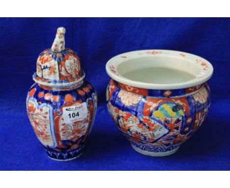 Japanese Imari porcelain baluster shaped vase and similar baluster shaped vase with domed cover, both having overall typical 